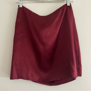 Reformation 100% silk mini skirt. New without tags. Mulberry / wine / dark red.